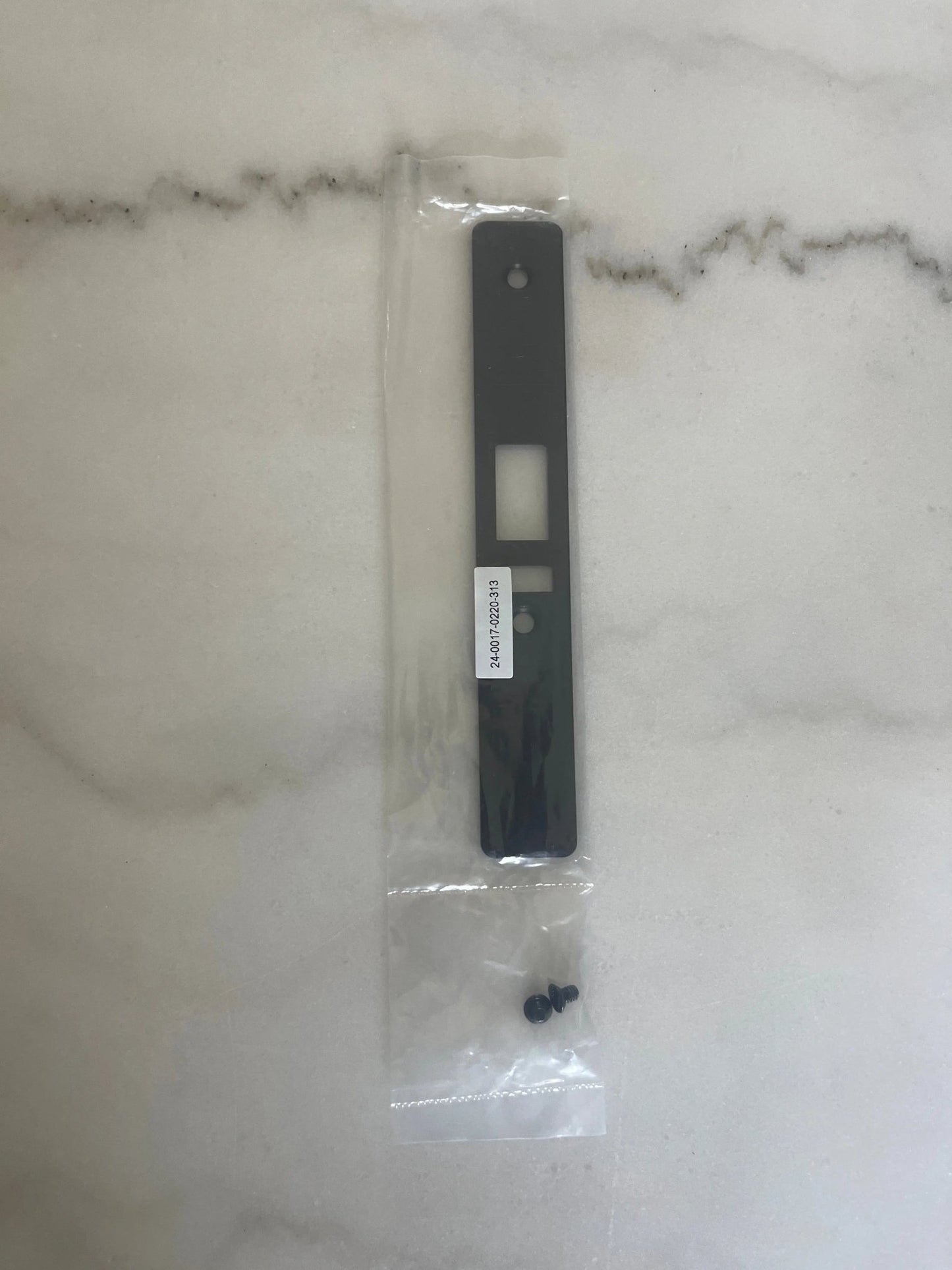 Adams Rite / ASSA ABLOY deadlatch faceplate in dark bronze (313), part 24-0017-0220-313—durable, corrosion-resistant plate for commercial storefront doors.